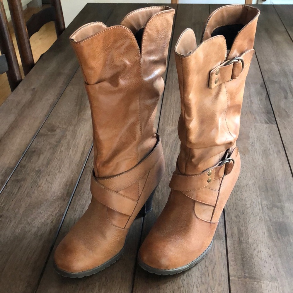 Tan boots gently worn with 3 in heel